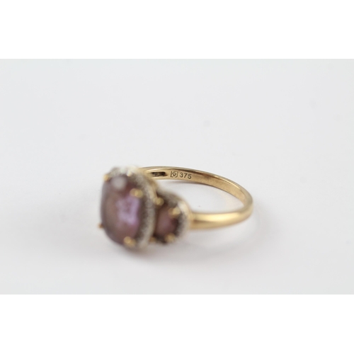 96 - 9ct gold amethyst three stone ring with diamond frame (3.3g) Size  N