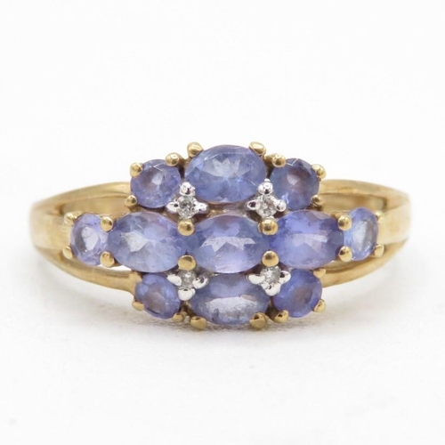 139 - 9ct gold tanzanite & diamond cluster ring (2.5g) Size  P