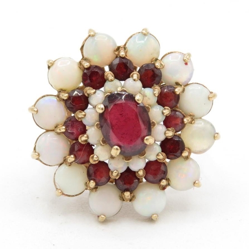 69 - 9ct gold white opal & garnet floral cluster cocktail ring (6.2g) Size  P 1/2