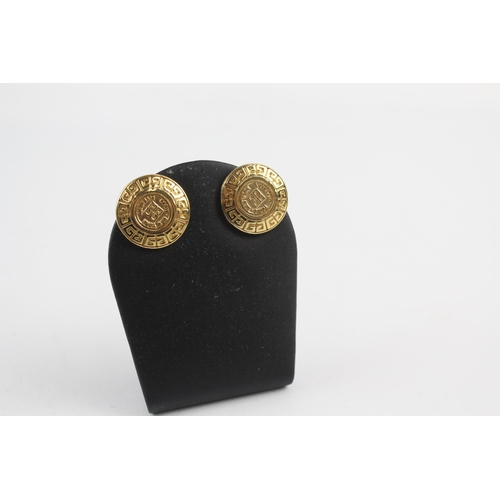 152 - Gold tone logo clip on earrings by designer Givenchy