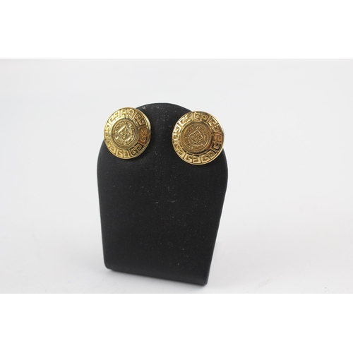 152 - Gold tone logo clip on earrings by designer Givenchy