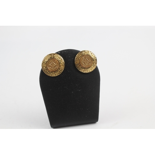 152 - Gold tone logo clip on earrings by designer Givenchy