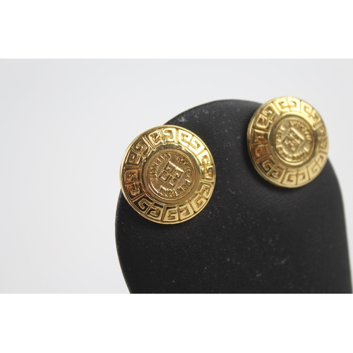 152 - Gold tone logo clip on earrings by designer Givenchy