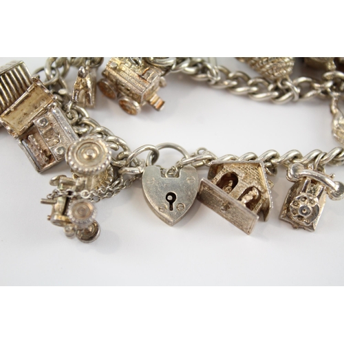 155 - Silver charm bracelet including opening charms