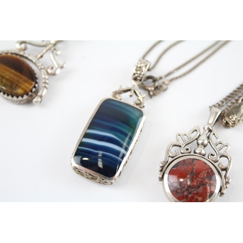 173 - Three silver double sided gemstone necklaces including spinner