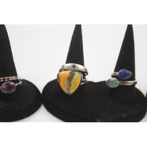 183 - A collection of silver gemstone rings including Lapis Lazuli