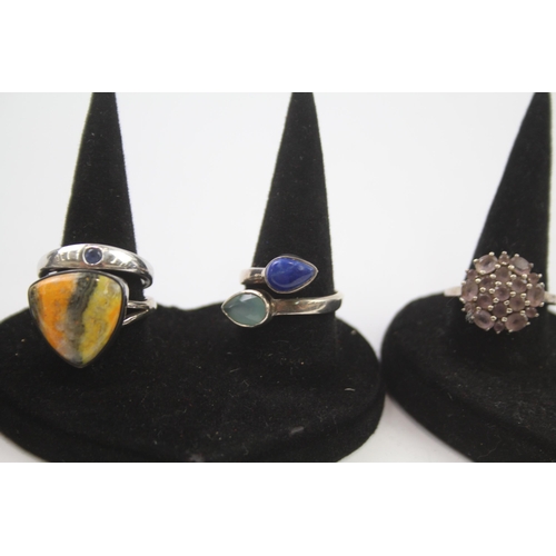 183 - A collection of silver gemstone rings including Lapis Lazuli