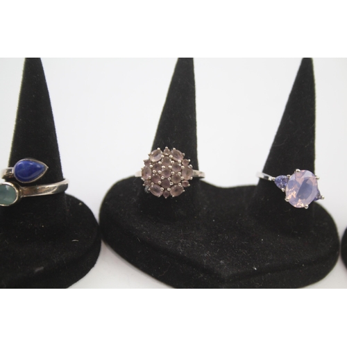 183 - A collection of silver gemstone rings including Lapis Lazuli