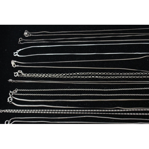 186 - A collection of silver chain necklaces including scroll