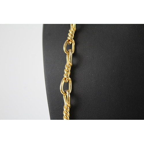 199 - Long length gold tone necklace by designer Christian Dior