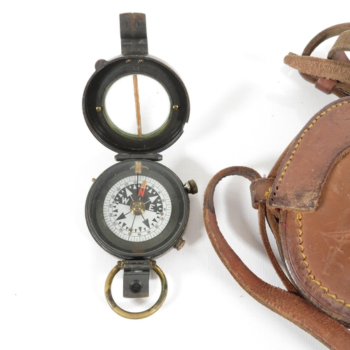 289 - Military compass with leather carrying pouch and straps