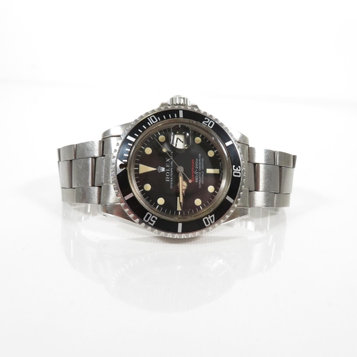 365 - 1973 ROLEX Single Red Submariner retailed by Garrard's in March 1973 with paperwork, inner and outer... 