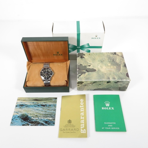 365 - 1973 ROLEX Single Red Submariner retailed by Garrard's in March 1973 with paperwork, inner and outer... 