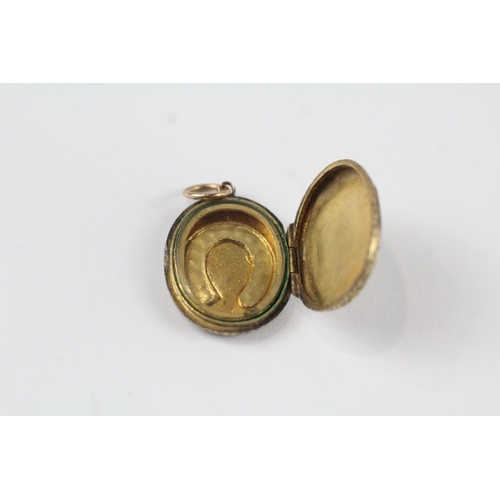 114 - 15ct gold antique seed pearl horseshoe locket (3.3g)