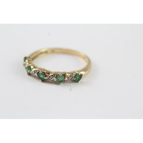 131 - 9ct gold emerald & diamond half eternity ring (1.9g) Size  P