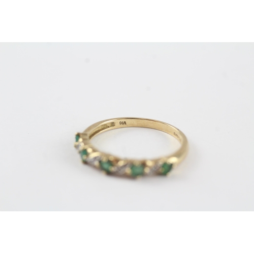 131 - 9ct gold emerald & diamond half eternity ring (1.9g) Size  P