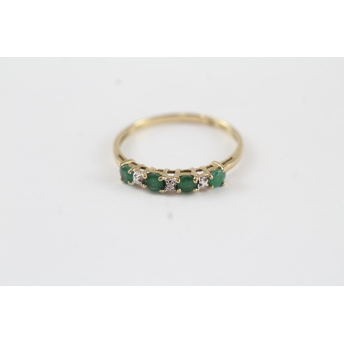 132 - 9ct gold emerald & diamond half eternity ring (1.1g) Size  P