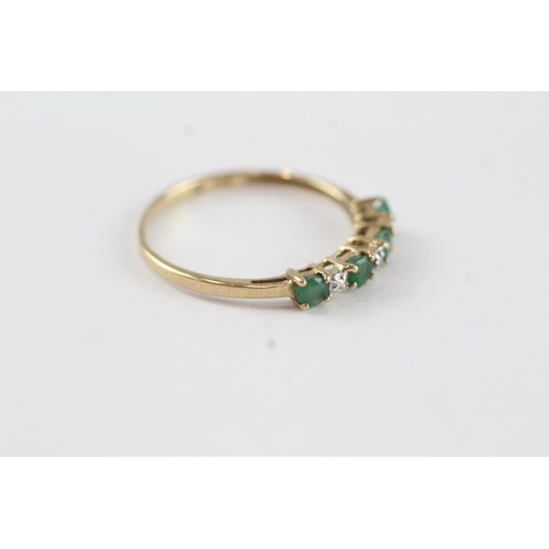 132 - 9ct gold emerald & diamond half eternity ring (1.1g) Size  P