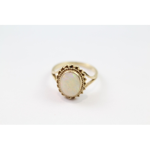 140 - 9ct gold white opal single stone ring (2g) Size  G