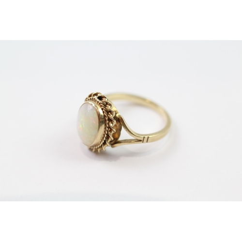 140 - 9ct gold white opal single stone ring (2g) Size  G