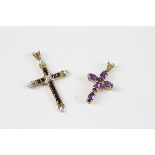 25 - 2 x 9ct gold diamond, sapphire & amethyst cross pendants (2.4g)