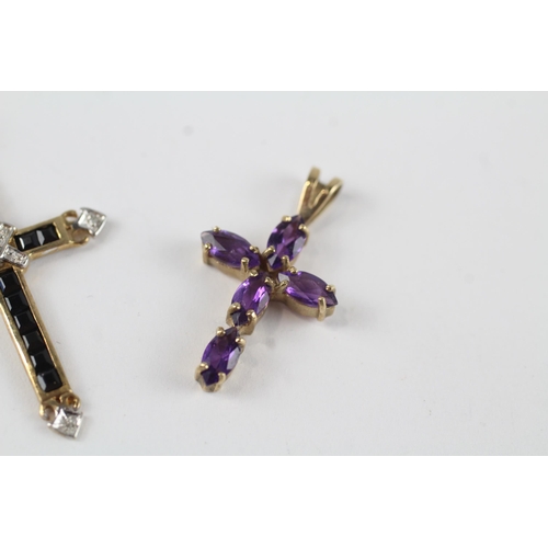 25 - 2 x 9ct gold diamond, sapphire & amethyst cross pendants (2.4g)