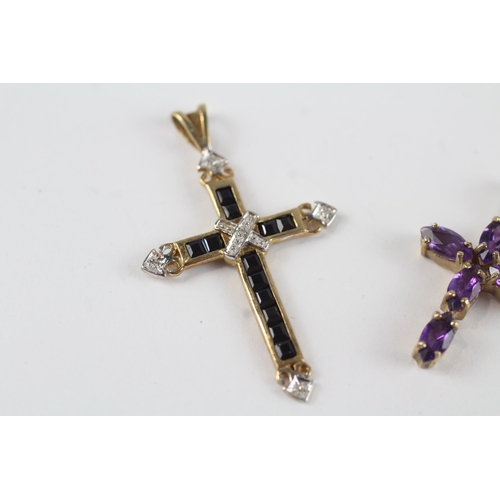 25 - 2 x 9ct gold diamond, sapphire & amethyst cross pendants (2.4g)