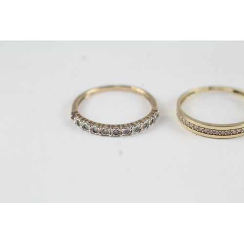 42 - 2x  half eternity rings, 1x with diamonds, 1x with CZ (2g) Size  L + M 1/2