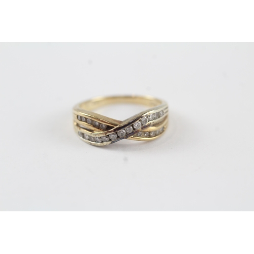 63 - 9ct gold diamond crossover ring (2.5g) Size  J