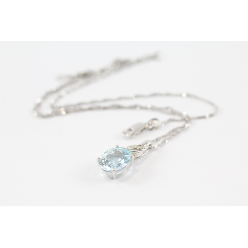 68 - 9ct gold aquamarine & diamond pendant & chain (2.6g)