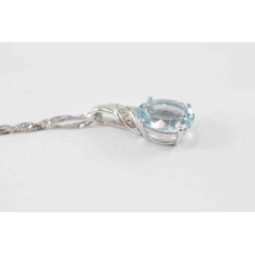 68 - 9ct gold aquamarine & diamond pendant & chain (2.6g)