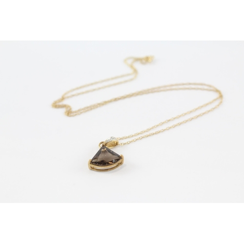 70 - 9ct gold smokey quartz & diamond pendant & chain (2.2g)