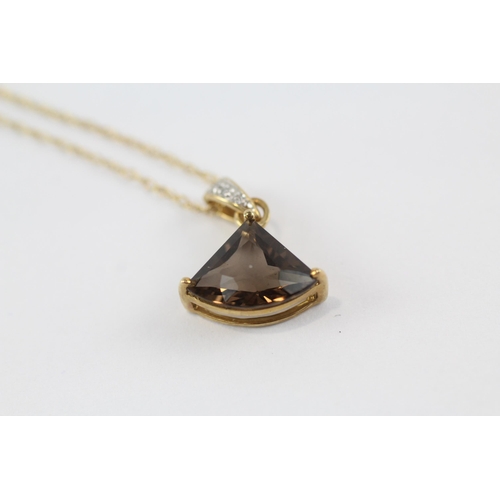 70 - 9ct gold smokey quartz & diamond pendant & chain (2.2g)