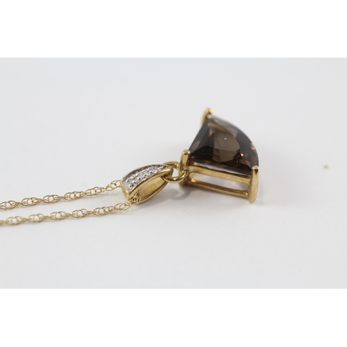 70 - 9ct gold smokey quartz & diamond pendant & chain (2.2g)