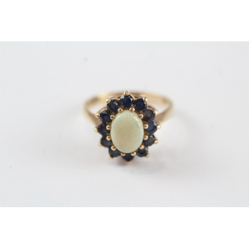 74 - 9ct gold white opal & sapphire oval cluster ring (3.1g) Size  L