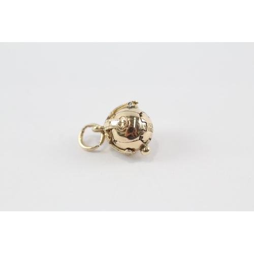 84 - 9ct gold & silver masonic orb charm (3.5g)