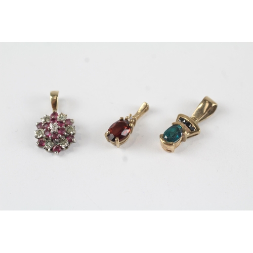 94 - 3 x 9ct gold diamond, ruby and blue gemstone set pendants (3.3g)