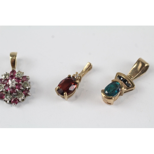 94 - 3 x 9ct gold diamond, ruby and blue gemstone set pendants (3.3g)