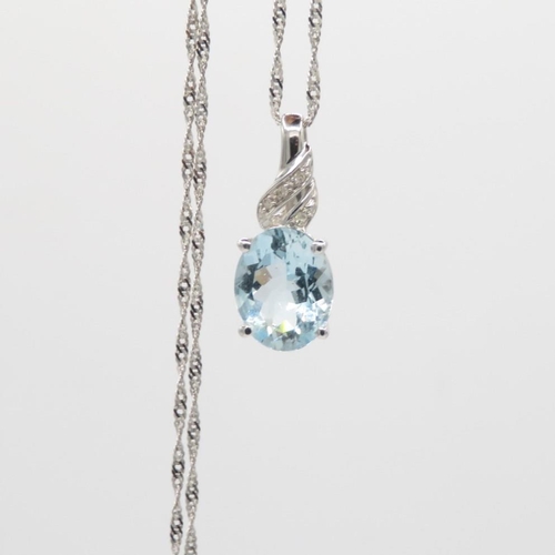 68 - 9ct gold aquamarine & diamond pendant & chain (2.6g)