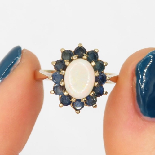 74 - 9ct gold white opal & sapphire oval cluster ring (3.1g) Size  L