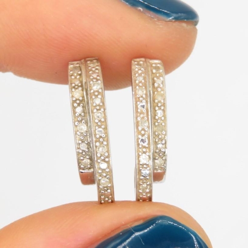 97 - 9ct gold diamond earrings (1.7g)