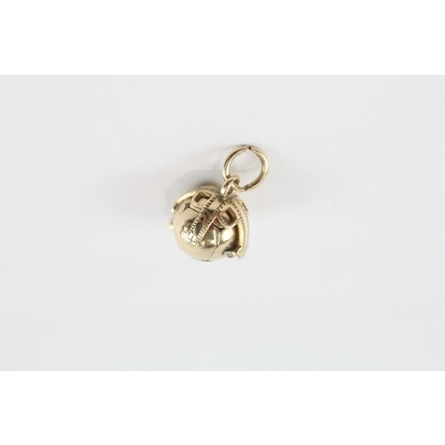 84 - 9ct gold & silver masonic orb charm (3.5g)