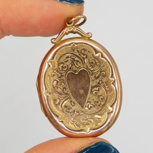 101 - 9ct rose gold antique scrolling foliate engraved oval locket (3.7g)