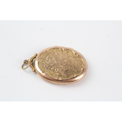 101 - 9ct rose gold antique scrolling foliate engraved oval locket (3.7g)