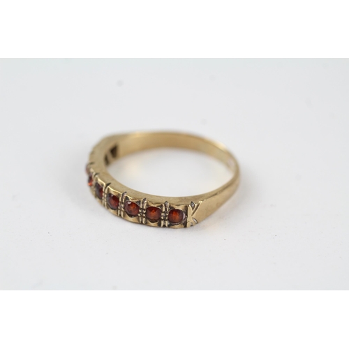 113 - 9ct gold vintage garnet set half hoop eternity ring (2.6g) Size  O