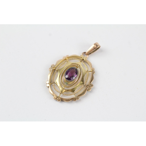 114 - 9ct gold purple paste openwork pendant (1.8g)