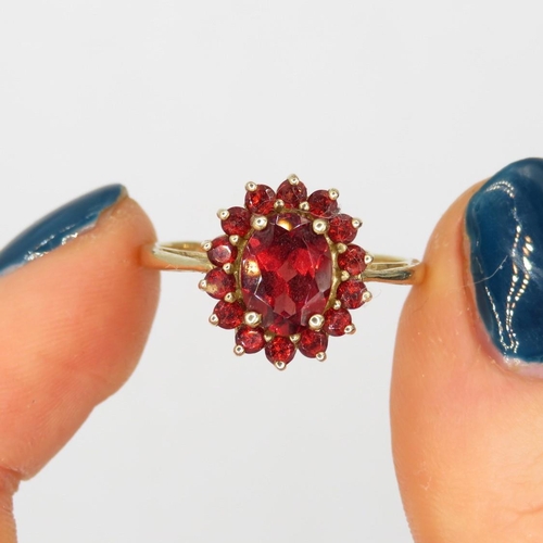 137 - 9ct gold garnet oval cluster ring (2.3g) Size  P+1/2