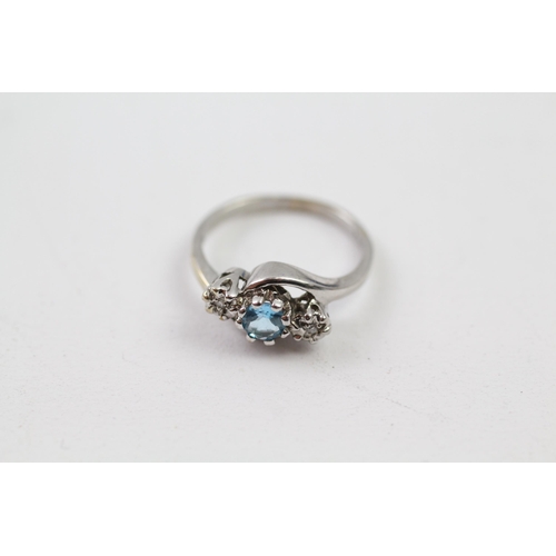 138 - 9ct white gold diamond & topaz three stone ring (1.9g) Size  J