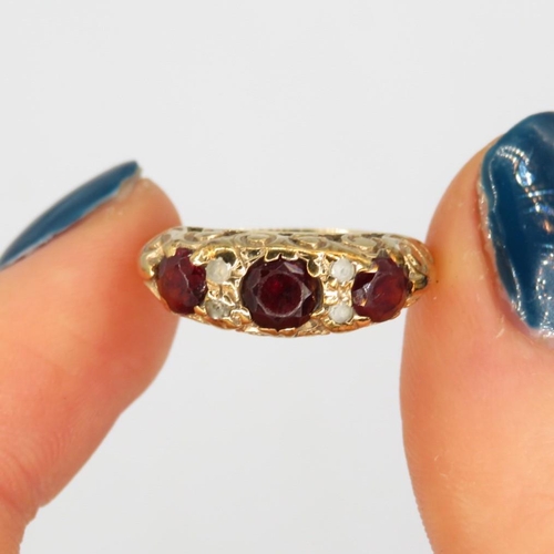 148 - 9ct gold diamond & garnet seven stone ring (2.4g) Size  L