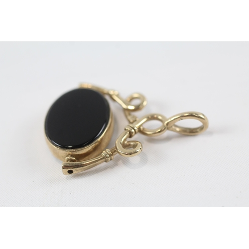 154 - 9ct gold onyx & mop swivel fob pendant (7.4g)